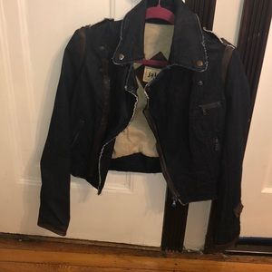 Denim and brown leather jacket